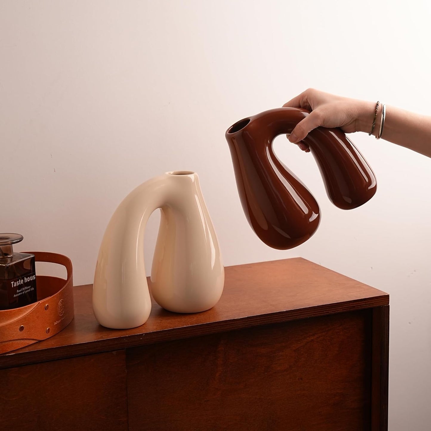 Brown Ceramic Vase – Glossy Modern Sculptural Décor, Arch Handle Artistic Design, Warm Earth-Tone Accent for Table, Shelf, or Entryway (7.5 in, Holds Water)